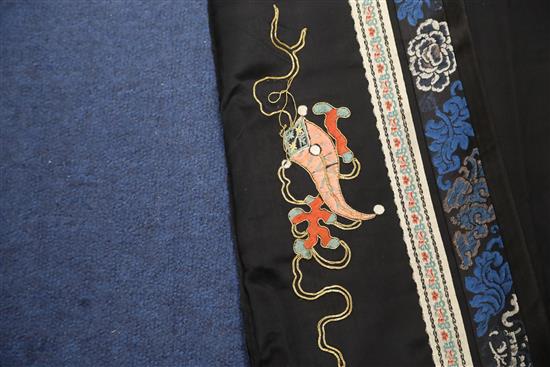 A Chinese embroidered black satin table frontal, late Qing dynasty, 211 x 56cm